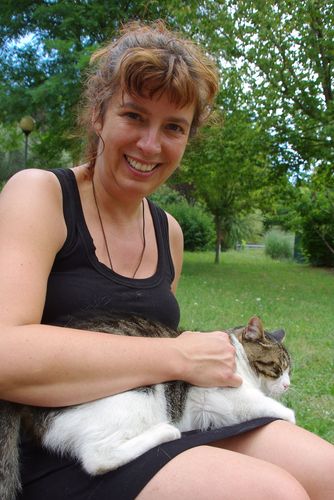 Laura with a cat on her lap